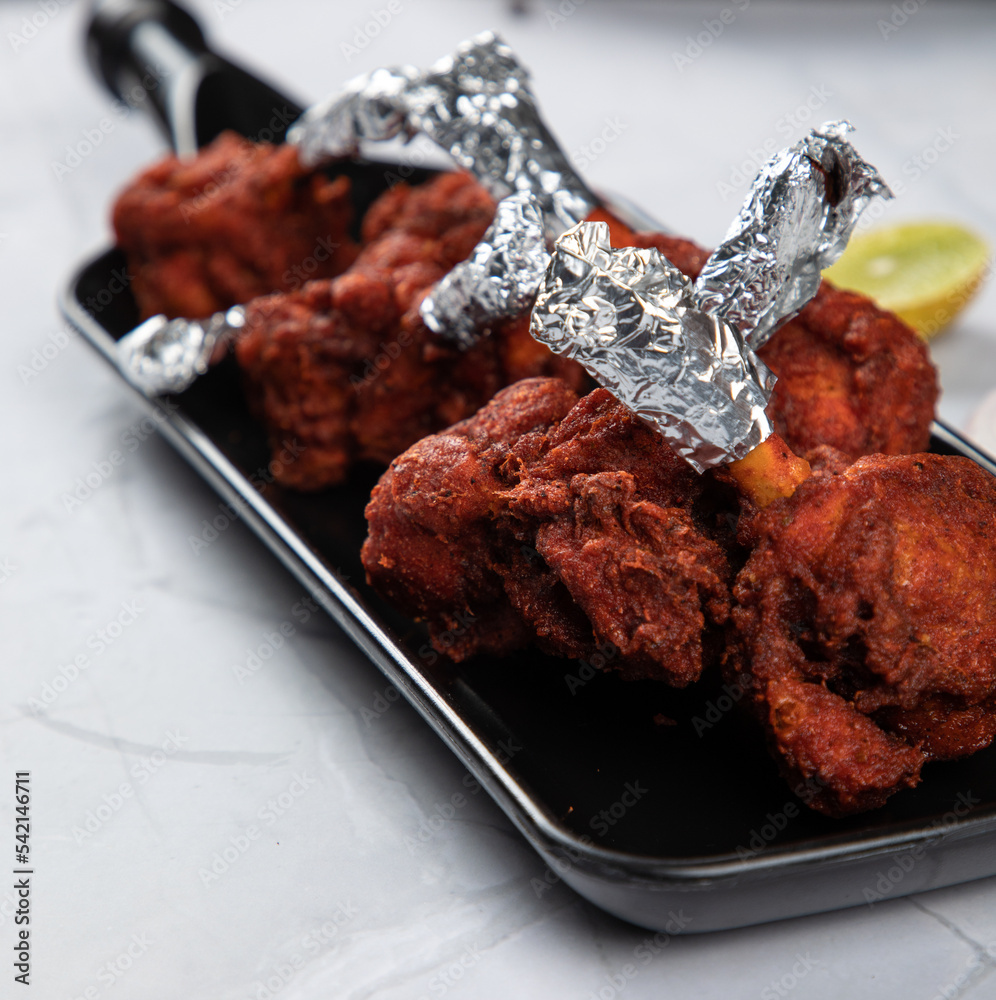 CHICKEN LOLLIPOP DRY A chicken starter in which chicken winglets are