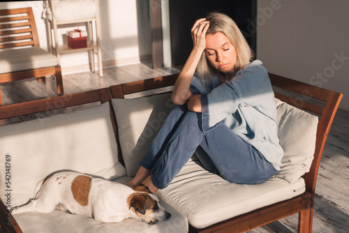 Konstfotografi Depressed lonely unhappy mental woman sitting alone on the sofa feel stress