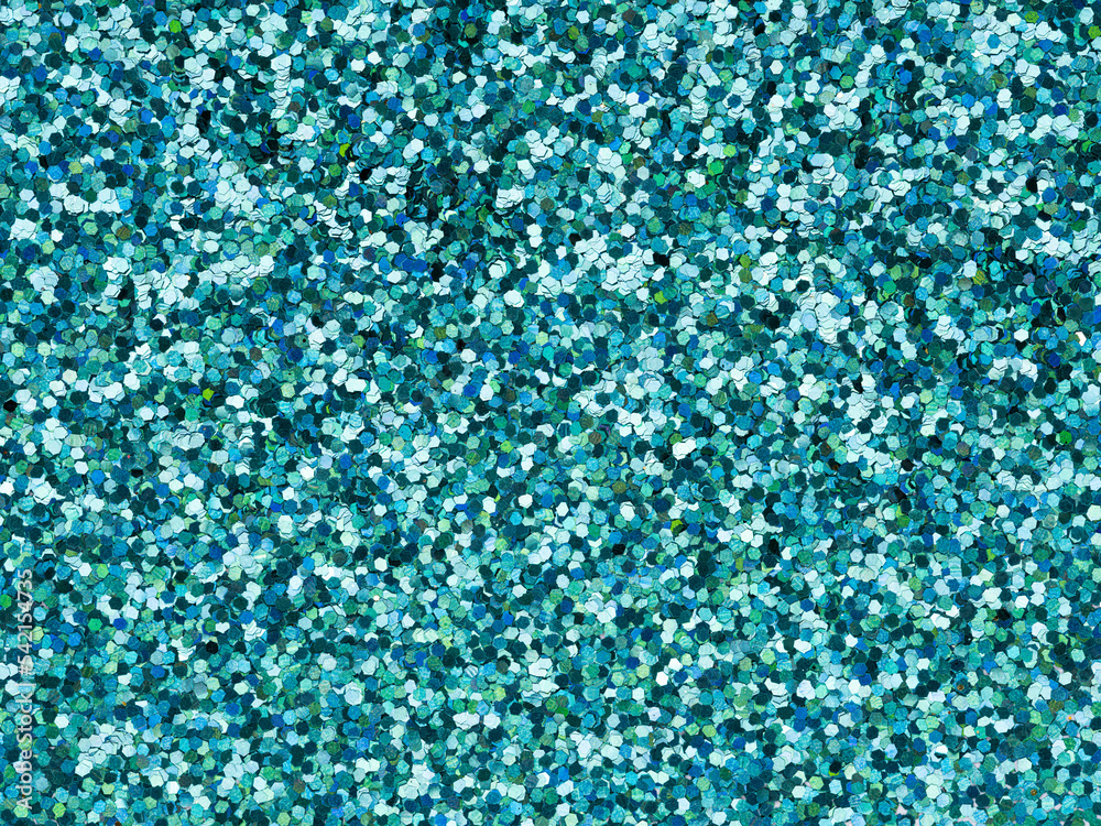 Blue glitter texture closeup. Saturated shiny holographic background for Christmas desktop, holiday New Year, xmas seasonal decoration, social events, greeting and wedding invitation card element. Blue glitter texture closeup. Saturated shiny holographic background for Christmas desktop, holiday New Year, xmas seasonal decoration, social events, greeting and wedding invitation card element.
