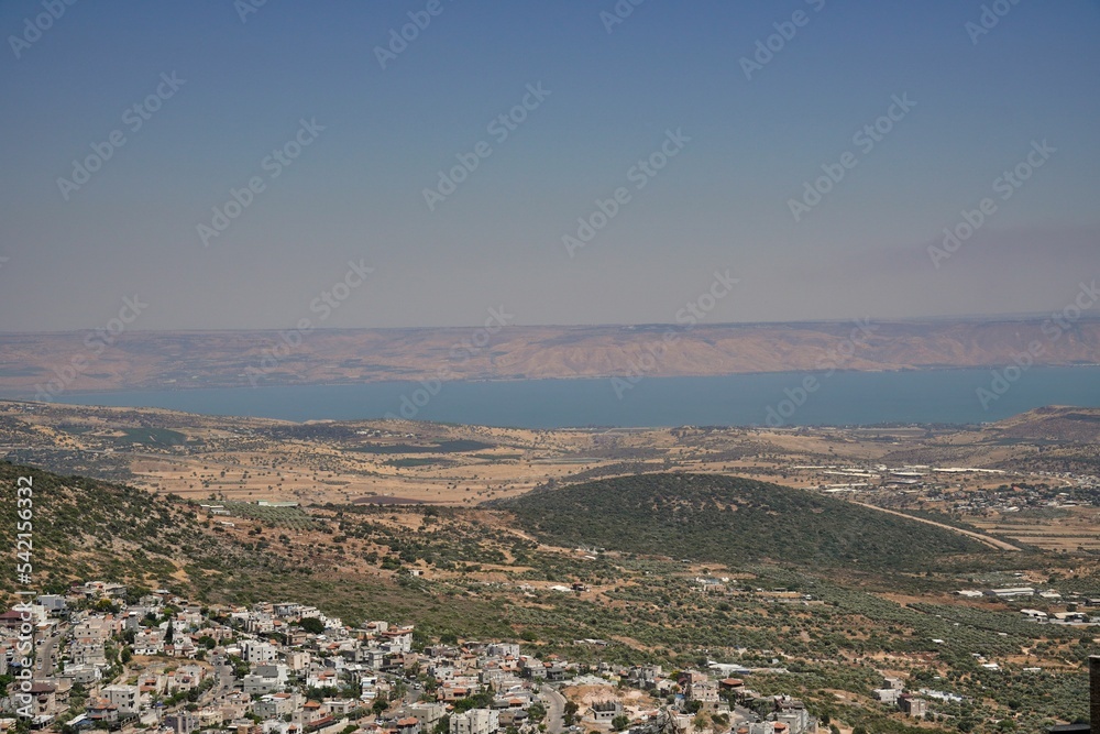Sea of Galilee with the village and mount Arbel, Golan Heights in the background, Israel, aerial