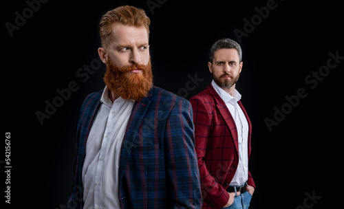 men in menswear isolated on black background with selective focus. bearded men in menswear