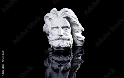 Gypsum copy of famous ancient statue Poseidon head isolated on a white background.