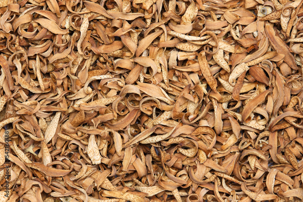 Dried orange blossoms, the fragrant flowers of the orange tree (Citrus sinensis). They are used in perfumery, to flavor food and as incense. Close-up, top view. Dried orange blossoms, the fragrant flowers of the orange tree (Citrus sinensis). They are used in perfumery, to flavor food and as incense. Close-up, top view.