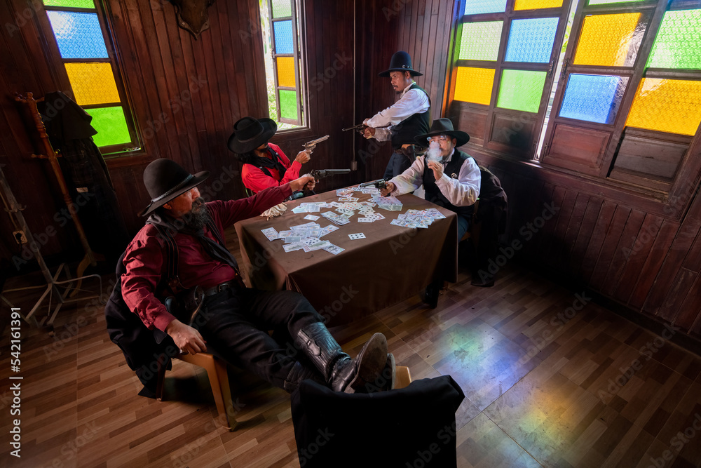 Cowboys group playing poker and card  gambler game in old American west saloon is cowboy vintage life style.