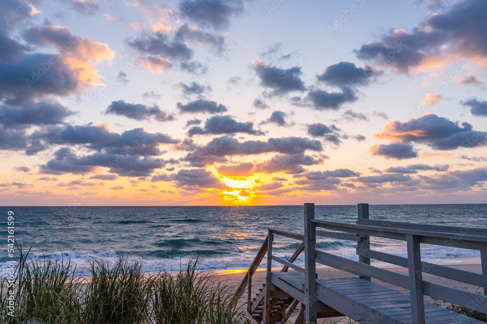 View of the rising sun over the Atlantic Ocean from the porch of a private house in Melbourne Beach, Florida, USA