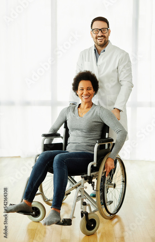 disability wheelchair doctor patient hospital medical disabled woman handicap nurse handicapped health young wheel care clinic