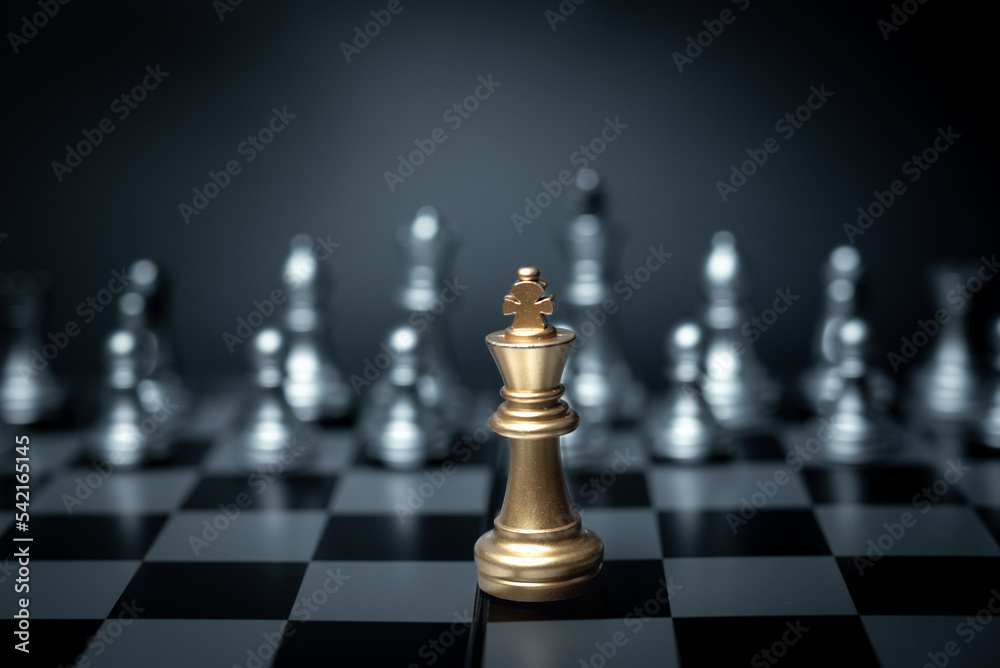 Golden King chess standing in front on board game. Concept leadership strategy business. Golden King chess standing in front on board game. Concept leadership strategy business.