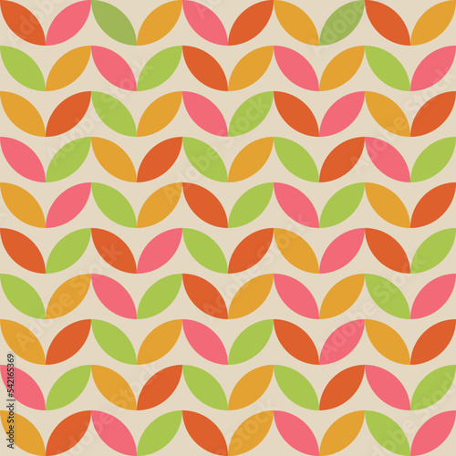 Mid Century Geometric leaves seamless pattern in orange, yellow, green and pink. For textile, fabric, wallpaper and home décor 