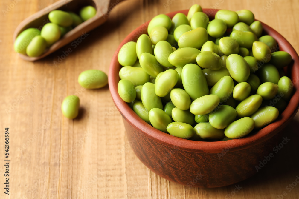 Bowl of delicious edamame beans on wooden table Bowl of delicious edamame beans on wooden table