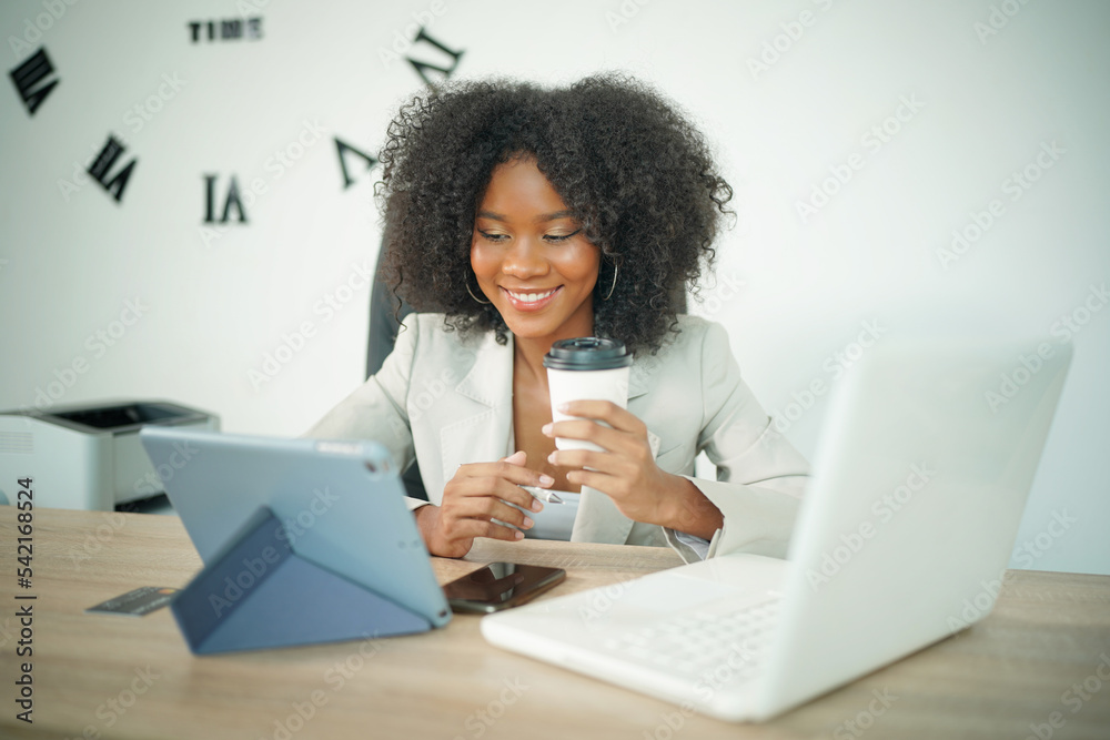Happy woman holding credit card to do shopping online on computer and smiling. Person feeling excited about buying clothes on website, using banking money to make purchase on internet Happy woman holding credit card to do shopping online on computer and smiling. Person feeling excited about buying clothes on website, using banking money to make purchase on internet