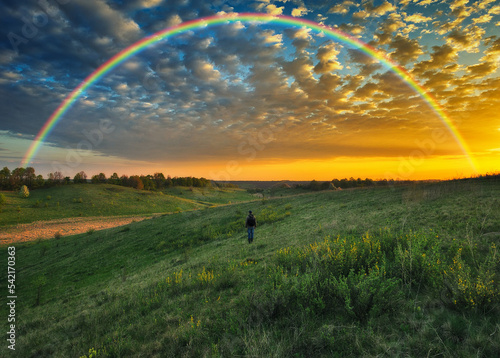 picturesque rainbow over the river. tourist enjoys colorful sunrise. nature of Ukraine