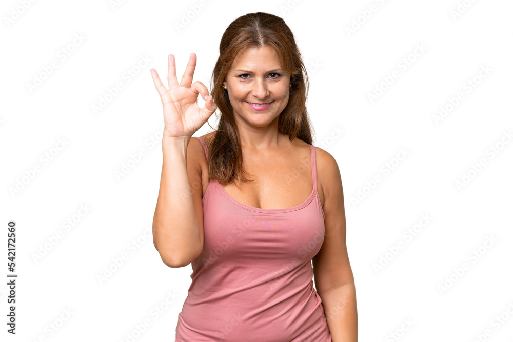 Middle-aged caucasian woman over isolated background showing ok sign with fingers Middle-aged caucasian woman over isolated background showing ok sign with fingers