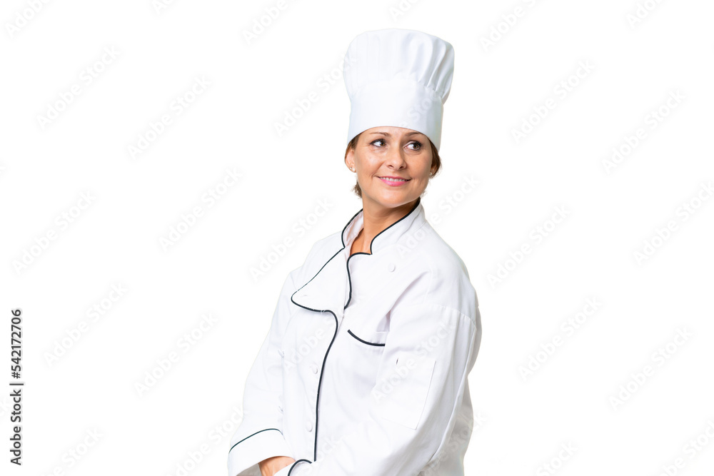 Middle-aged chef woman over isolated background with arms crossed and happy Middle-aged chef woman over isolated background with arms crossed and happy