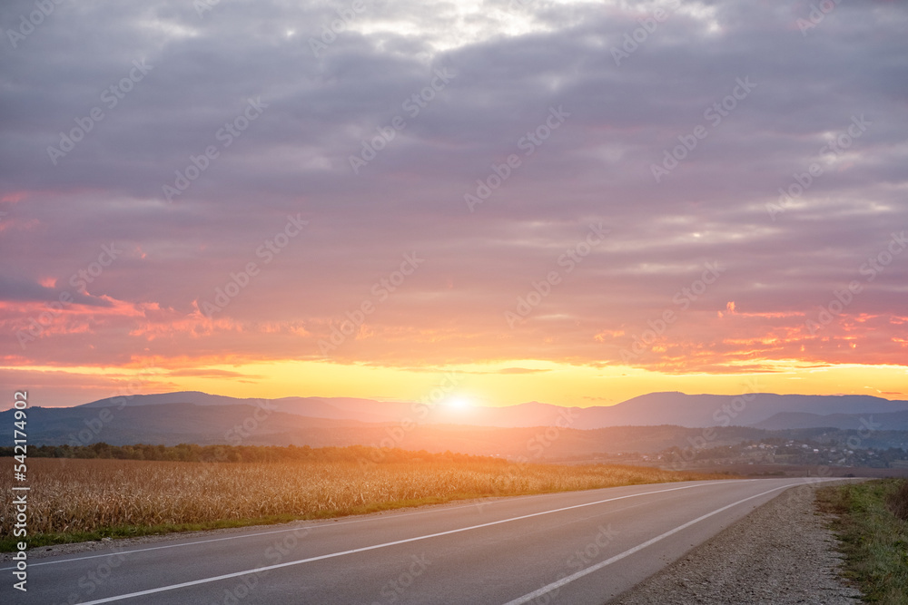 empty asphalt road in sunset time with magic sky