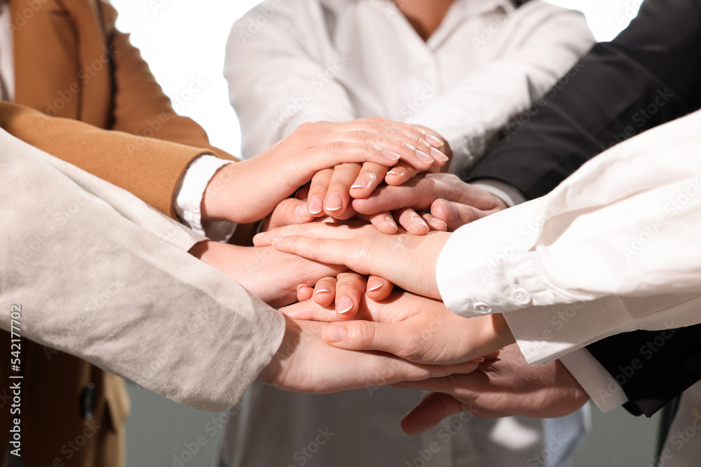Group of people holding hands together, closeup. Unity concept Group of people holding hands together, closeup. Unity concept