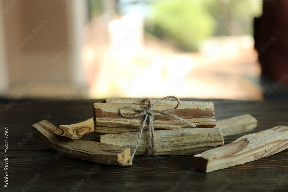 Palo santo sticks on wooden table, closeup Palo santo sticks on wooden table, closeup
