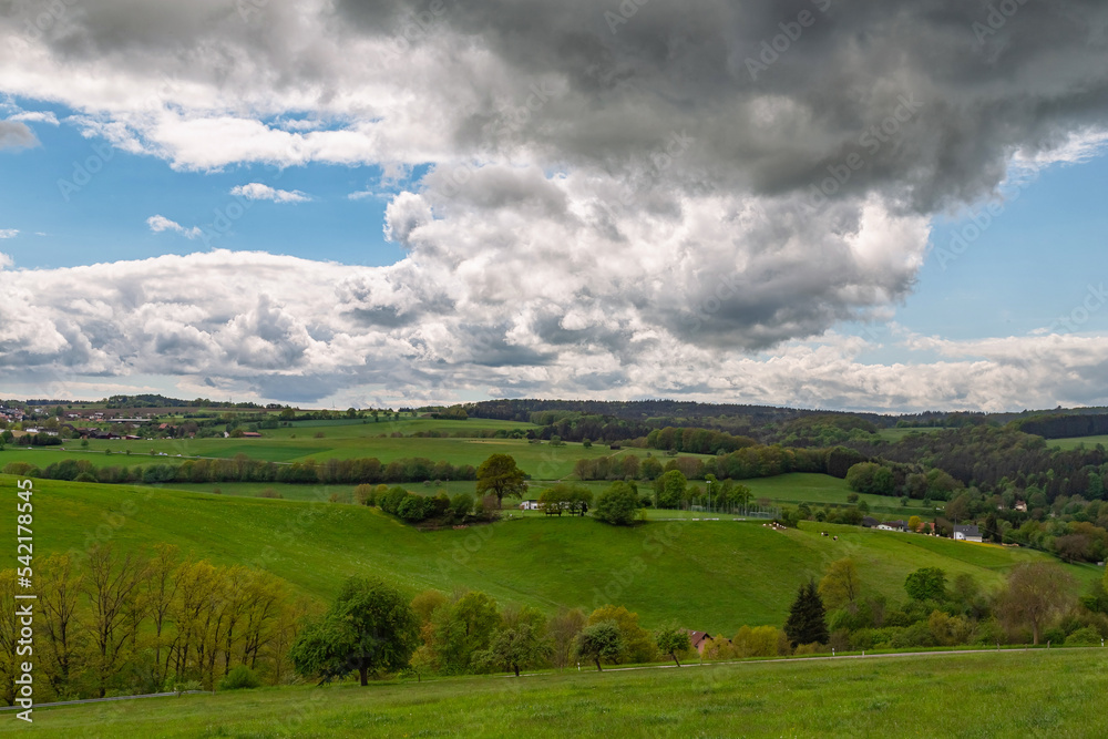 weather clouds over the forest in Germanys Odenwald region weather clouds over the forest in Germanys Odenwald region