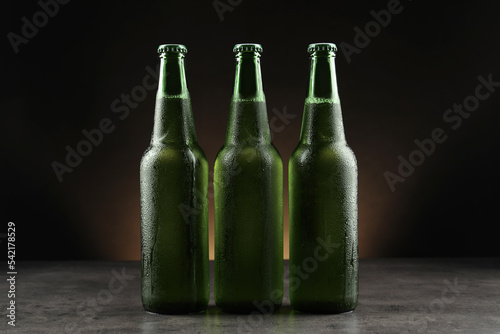 Many bottles of beer on grey table