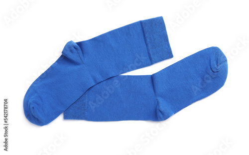Pair of blue socks on white background, top view