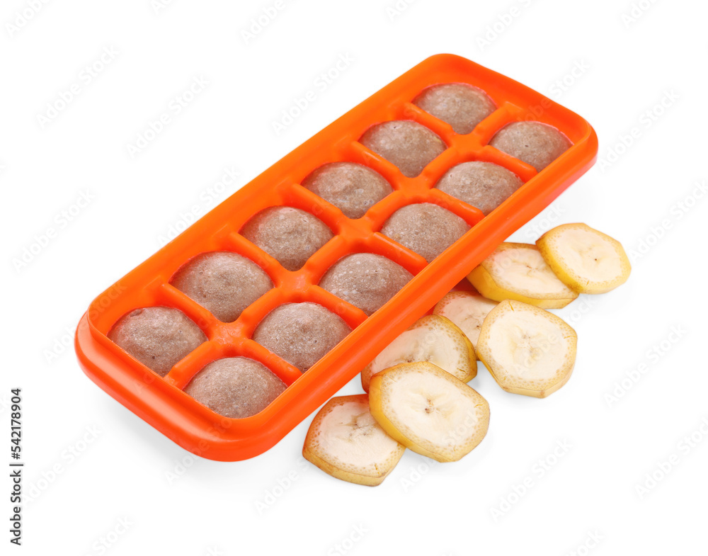 Banana puree in ice cube tray and ingredients on white background. Ready for freezing Banana puree in ice cube tray and ingredients on white background. Ready for freezing