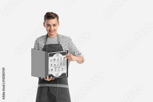 Young male barista with men...