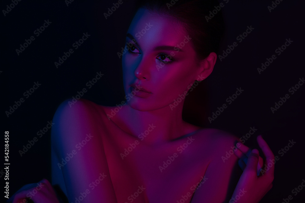 Woman on pink blue neon background. Woman on pink blue neon background.