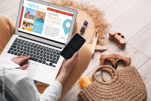Female travel blogger with ...