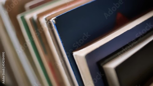 Old books on a wooden shelf, bookshelf close-up.  stacked book in the library.