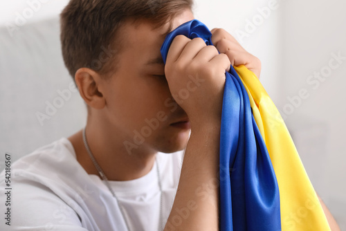 Young man with flag of Ukra...