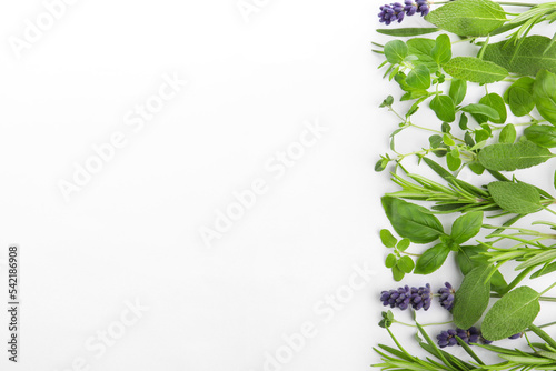фотографія Many different aromatic herbs on white background, flat lay