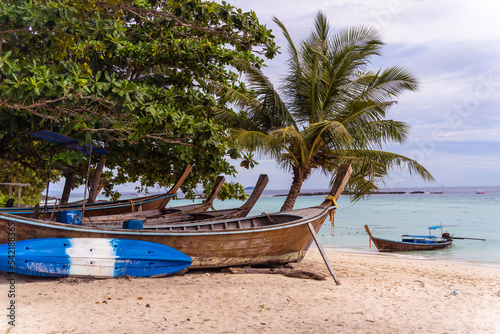 Traditional Thai boats on the beach near ocean