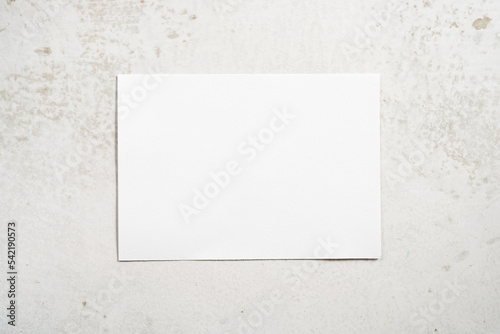 white rectangle paper on marble background 