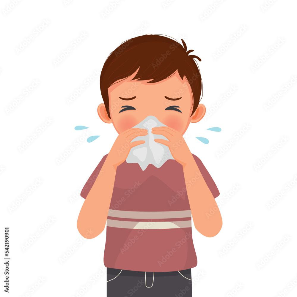 Cute little boy sneezing with flu and cold allergic symptoms blowing nose into tissue paper Cute little boy sneezing with flu and cold allergic symptoms blowing nose into tissue paper