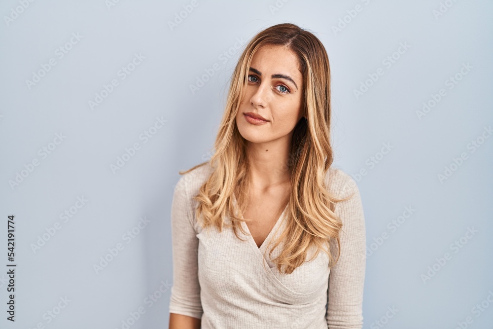 Young blonde woman standing over isolated background looking sleepy and tired, exhausted for fatigue and hangover, lazy eyes in the morning. Young blonde woman standing over isolated background looking sleepy and tired, exhausted for fatigue and hangover, lazy eyes in the morning.