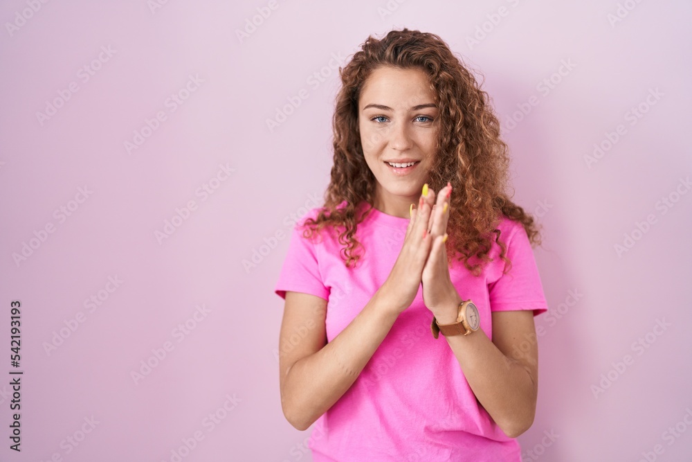 Young caucasian woman standing over pink background clapping and applauding happy and joyful, smiling proud hands together Young caucasian woman standing over pink background clapping and applauding happy and joyful, smiling proud hands together