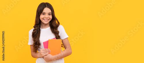 agenda. happy child hold notebook. teen girl with notepad. kid planning her work. Horizontal isolated poster of school girl student. Banner header portrait of schoolgirl copy space.