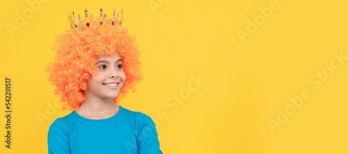 nice smile. imagine herself a princess. funny child in diadem. selfish teen girl in tiara. Funny teenager child in wig, party poster. Banner header, copy space.