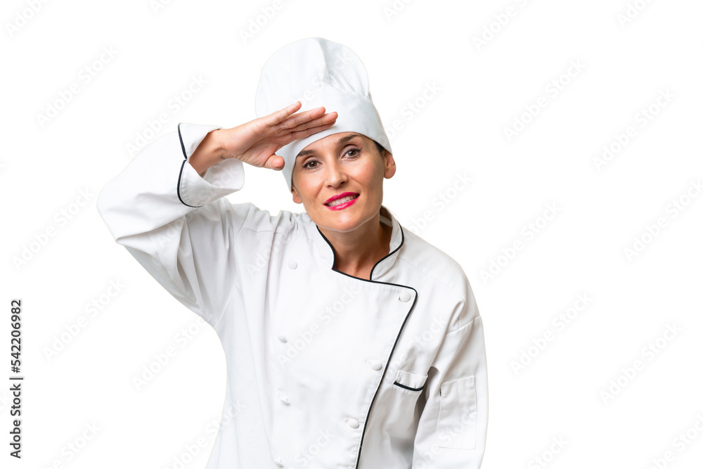 Middle-aged chef woman over isolated background looking far away with hand to look something
