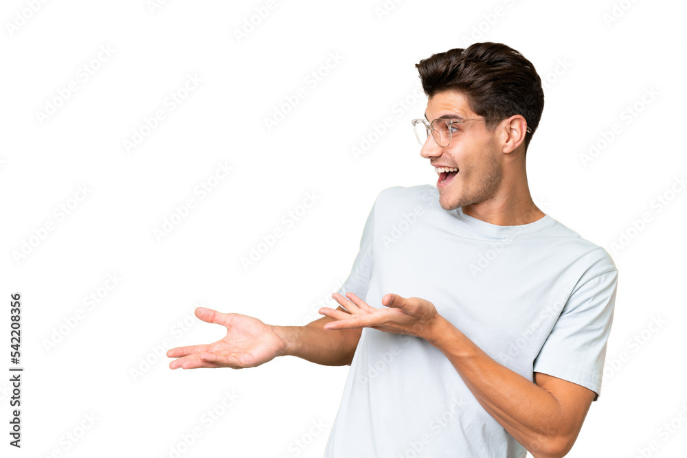 Young caucasian handsome man over isolated background with surprise expression while looking side Young caucasian handsome man over isolated background with surprise expression while looking side