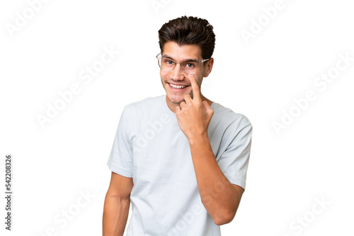 Young caucasian handsome man over isolated background showing something