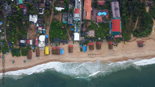Goa, India 19th October 2022: 4k drone shots of the Calangute Beach in North Goa. Calangute is also famous for its water sport activities. A belt of 4 beaches in Goa. Sea waves and beautiful oceans  photo