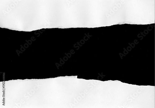 white paper tear on black background