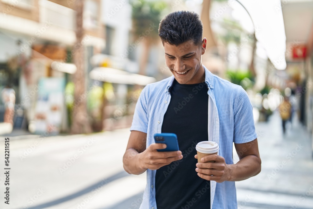 Young hispanic man using smartphone drinking coffee at street Young hispanic man using smartphone drinking coffee at street