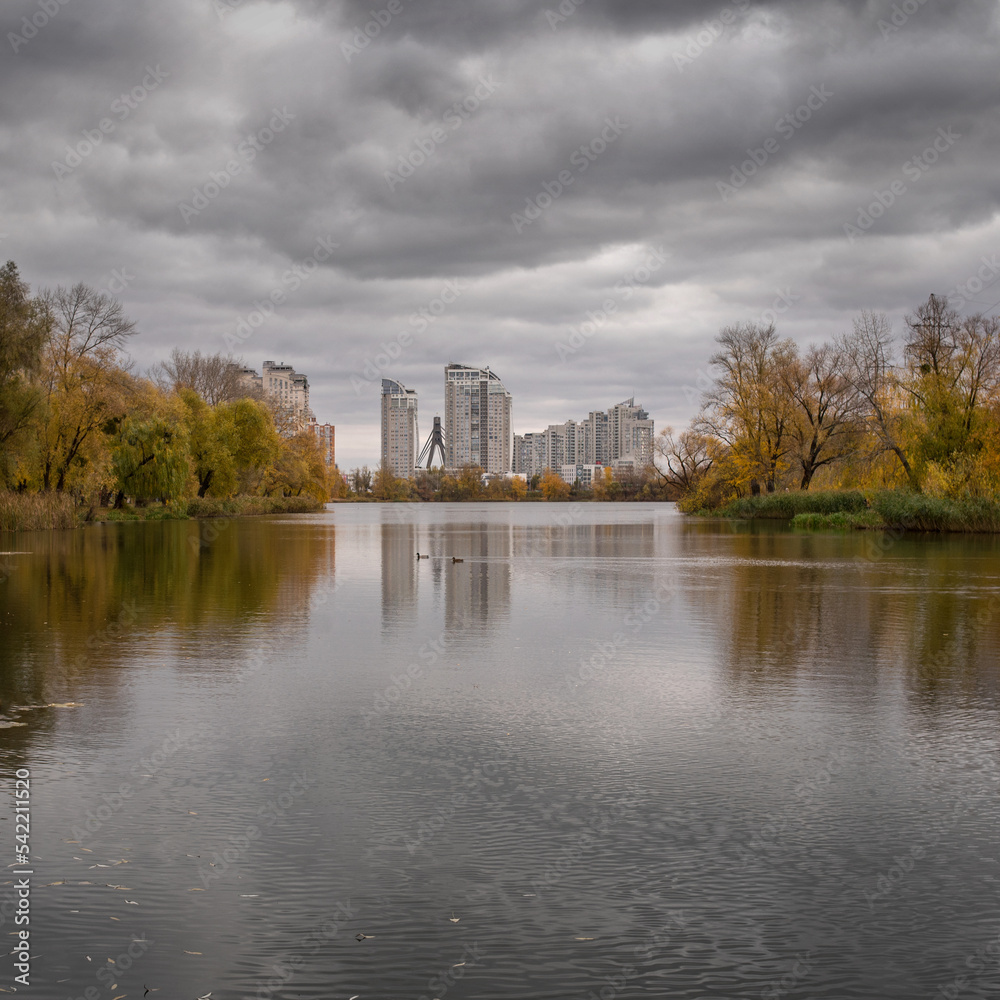 Verbne lake in Obolon in Kyiv: cloudy autumn day and reflection in the water