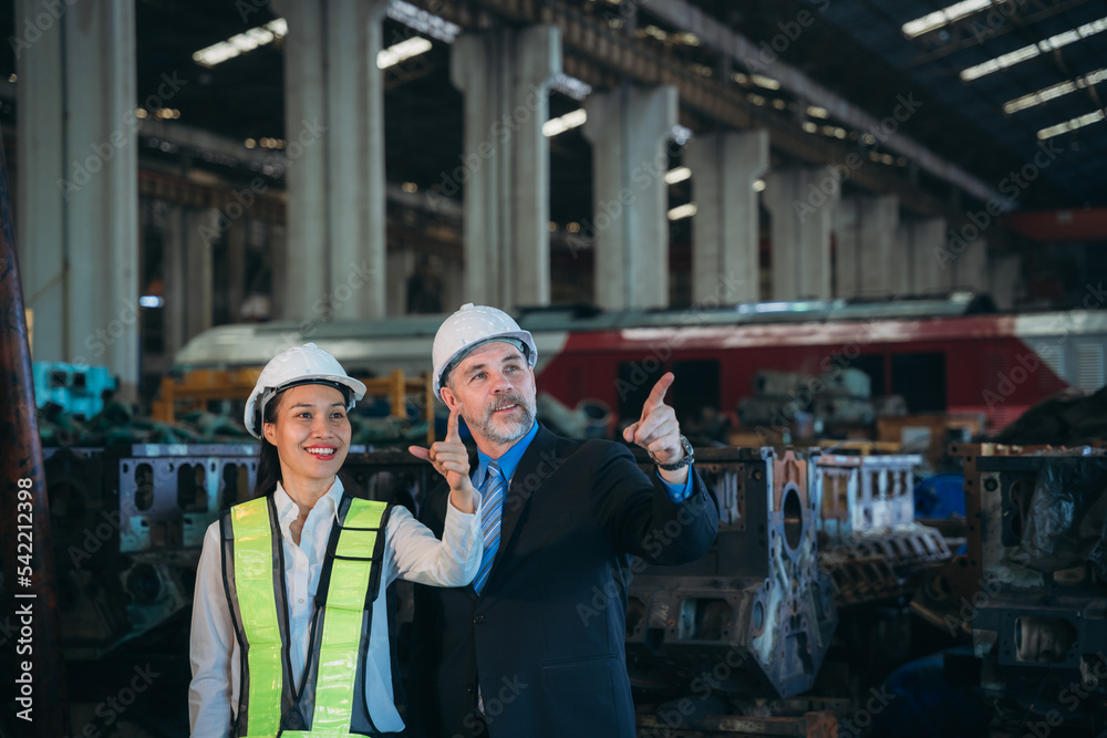Portrait of Professional Engineers express a high level of confidence at the railway garage.