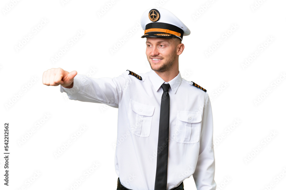 Airplane pilot man over isolated background giving a thumbs up gesture Airplane pilot man over isolated background giving a thumbs up gesture
