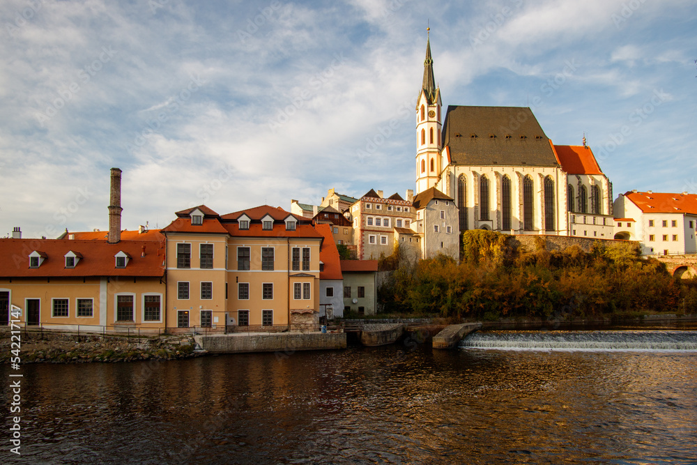 Picturesque autumn cityscape of Cesky Krumlov overlooking its historic centre and ancient Castle on bank of Vltava river, Czech Republic