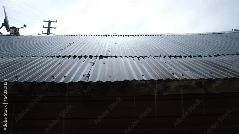 it's raining on an old roof. it's raining on an old roof.