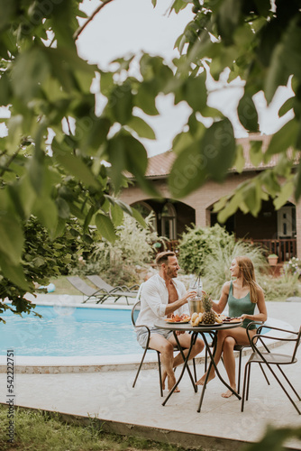 Young couple sitting in the...