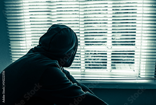 Photos Young Man near the Window